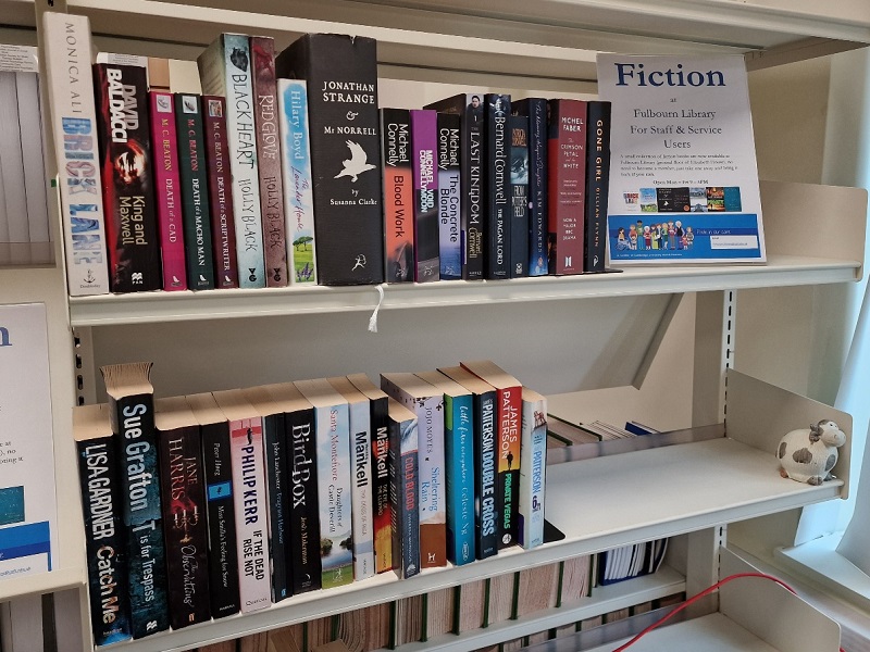 Shelf of fiction books at Fulbourn library